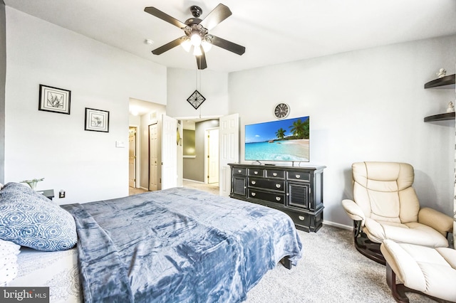 carpeted bedroom featuring lofted ceiling and ceiling fan