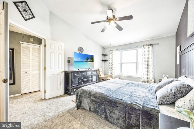 bedroom featuring vaulted ceiling, light colored carpet, and ceiling fan