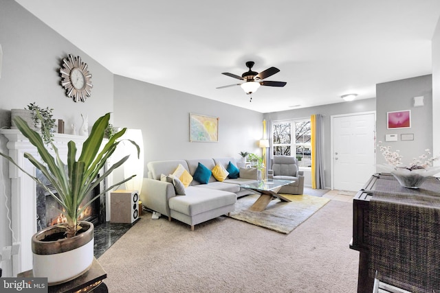 living room with light colored carpet and ceiling fan