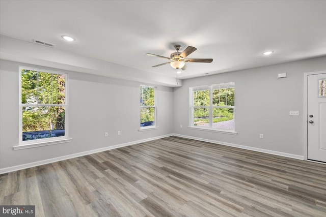 unfurnished room featuring ceiling fan and light wood-type flooring