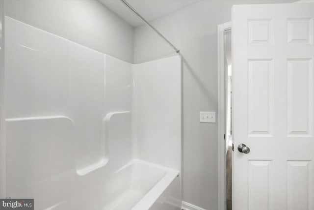 bathroom featuring  shower combination