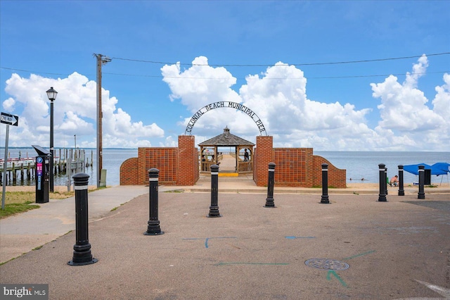 view of community with a water view and a gazebo