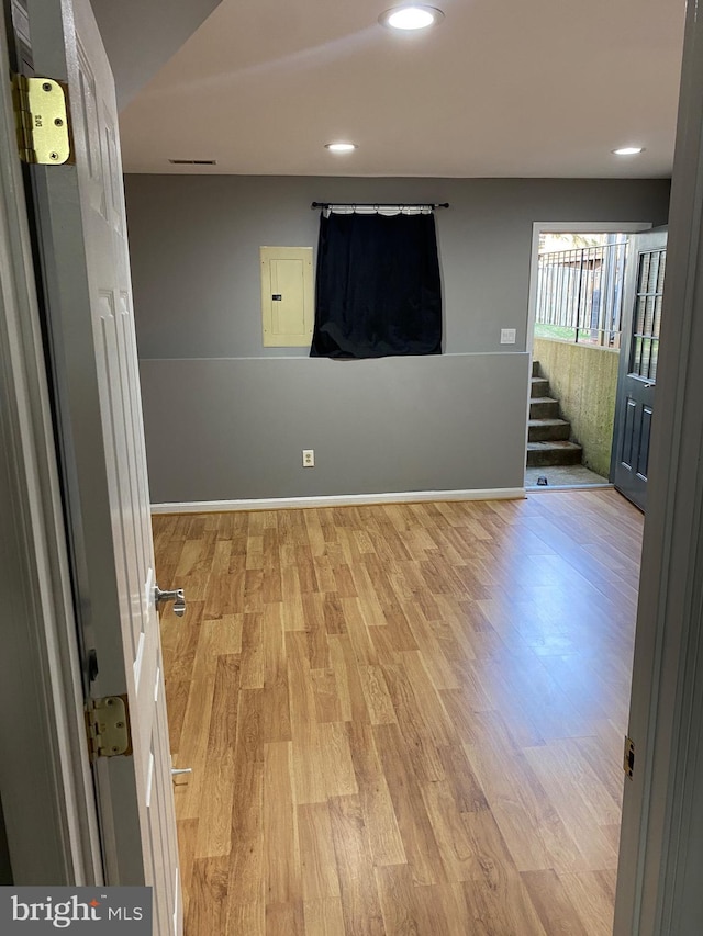 unfurnished room featuring light hardwood / wood-style floors