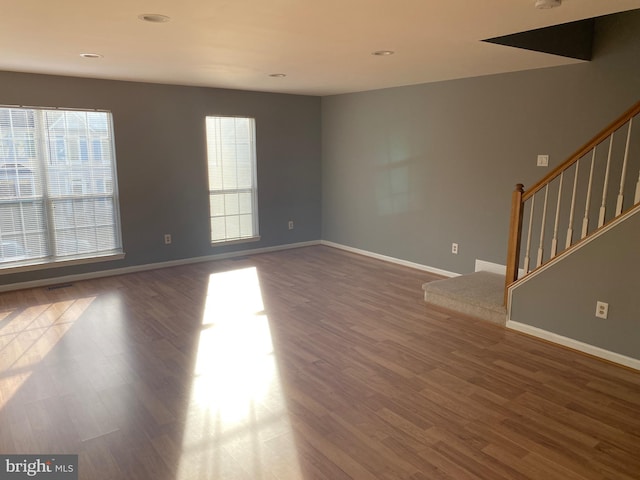 spare room featuring dark hardwood / wood-style floors