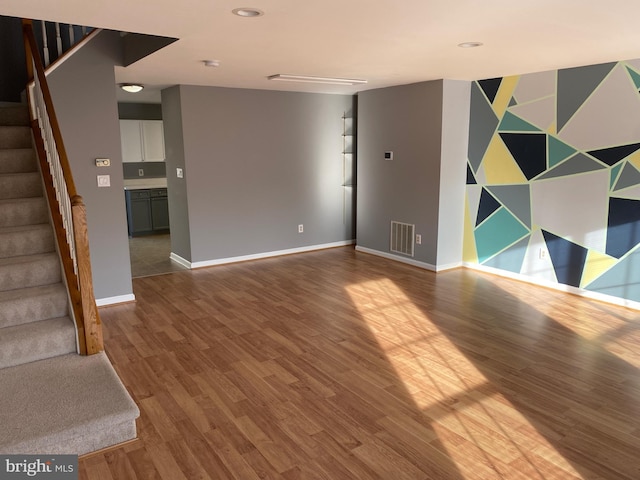 empty room featuring wood-type flooring