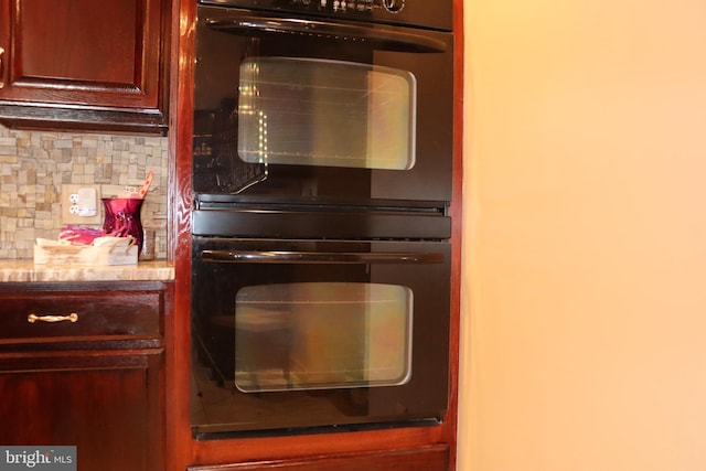 kitchen featuring tasteful backsplash and double oven