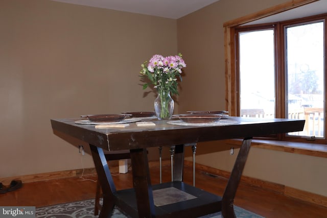 dining area with hardwood / wood-style floors