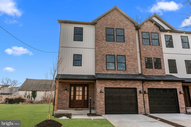 view of front of property with a garage and a front lawn