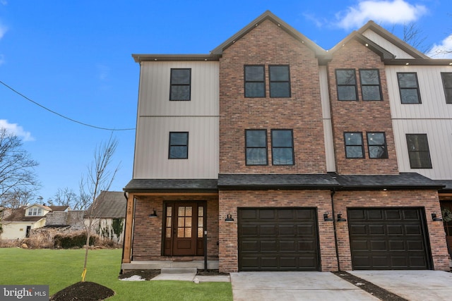 view of front of home with a garage and a front lawn