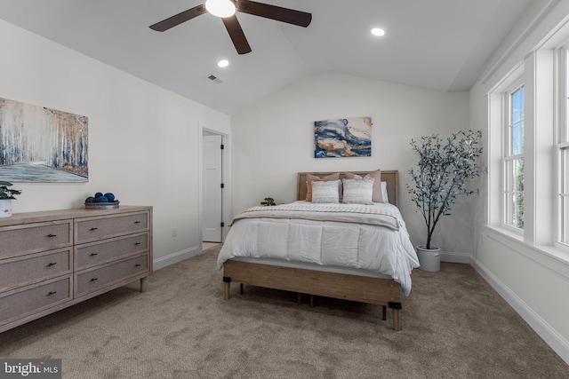 carpeted bedroom featuring vaulted ceiling and ceiling fan