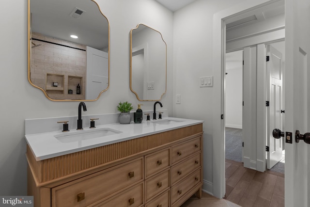 bathroom featuring vanity and hardwood / wood-style floors