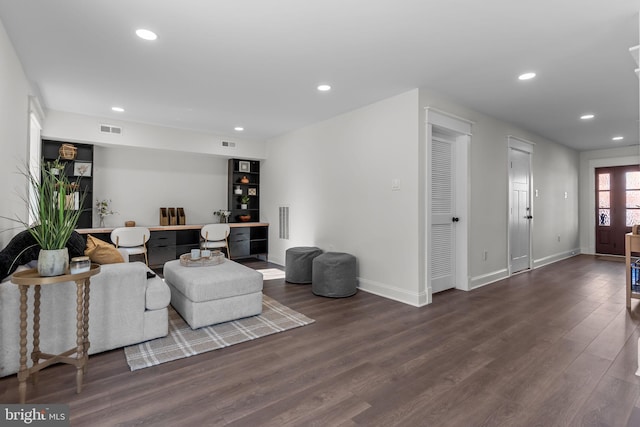 living room featuring dark hardwood / wood-style flooring