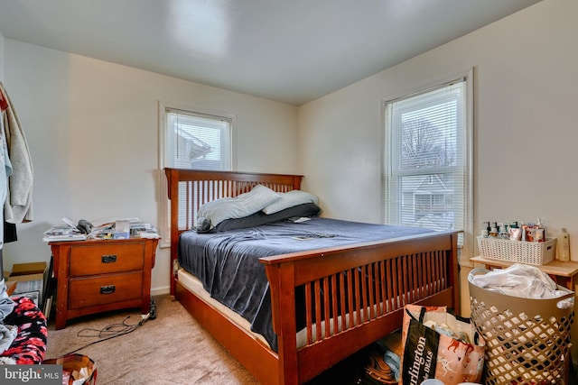 bedroom featuring light carpet