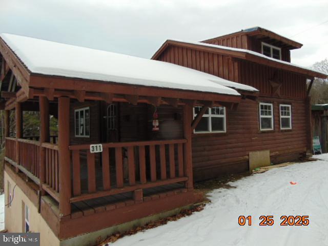 view of snow covered house