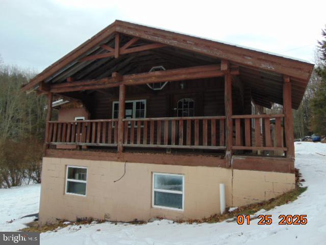 view of snow covered property