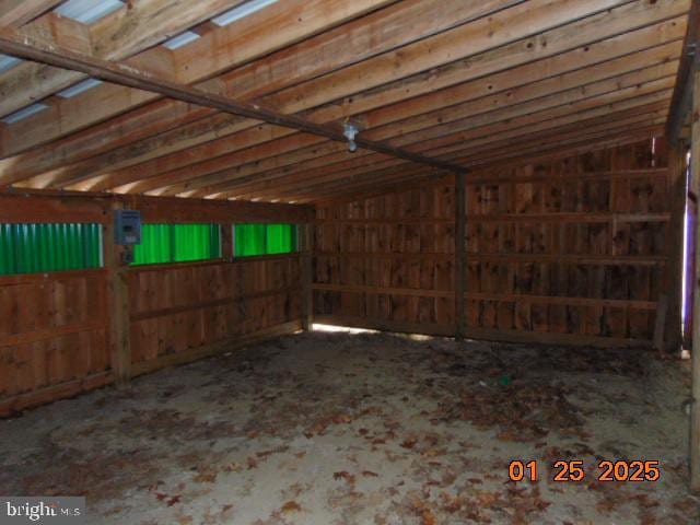 miscellaneous room featuring lofted ceiling