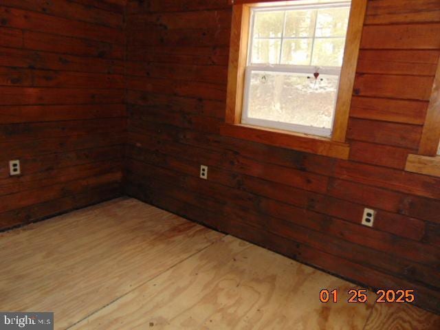 empty room with wooden walls