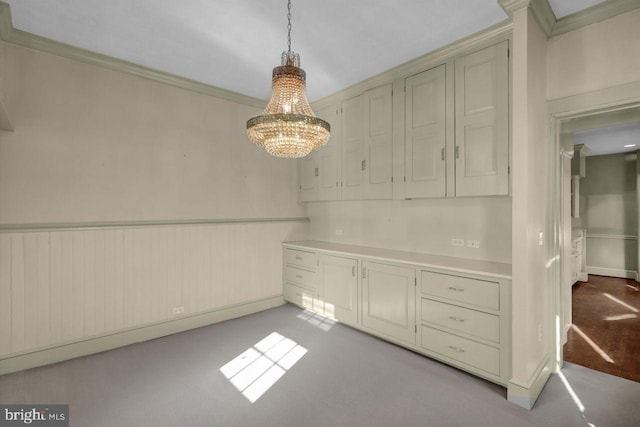 unfurnished dining area with ornamental molding and light carpet