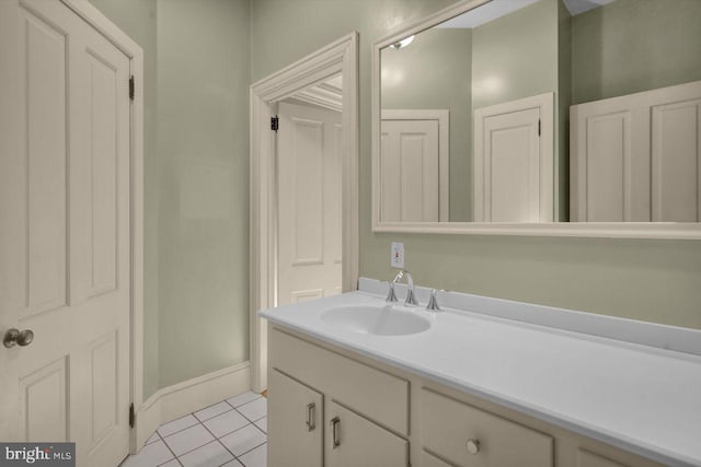 bathroom with tile patterned flooring and vanity