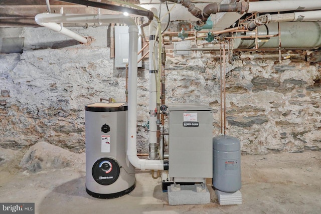 utility room featuring water heater