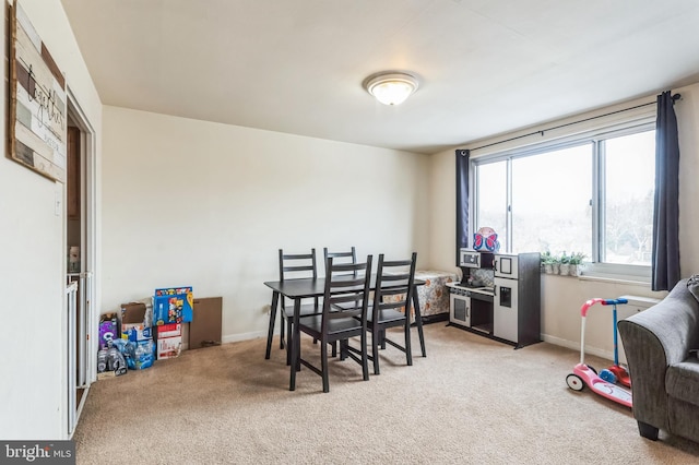 dining space with carpet floors