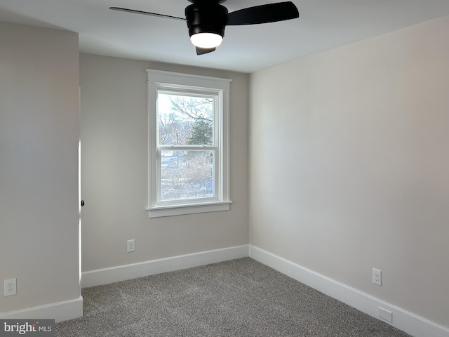 empty room with ceiling fan and carpet flooring