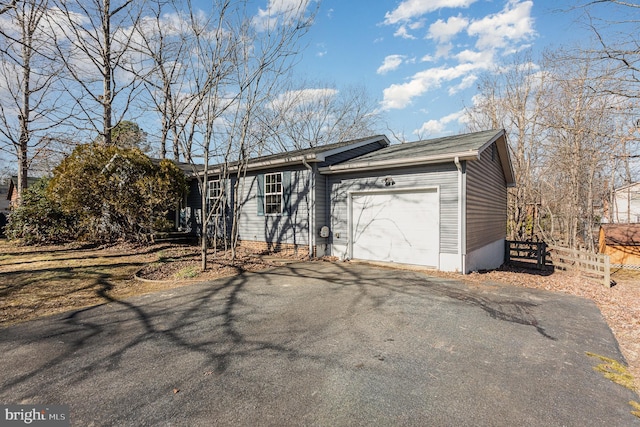 ranch-style house featuring a garage