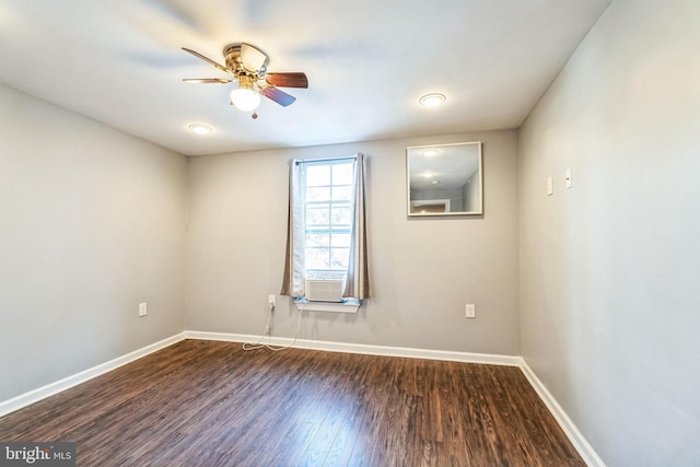 unfurnished room with dark hardwood / wood-style flooring, cooling unit, and ceiling fan