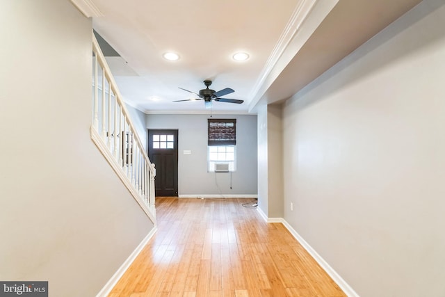 foyer entrance featuring crown molding, ceiling fan, and light hardwood / wood-style floors