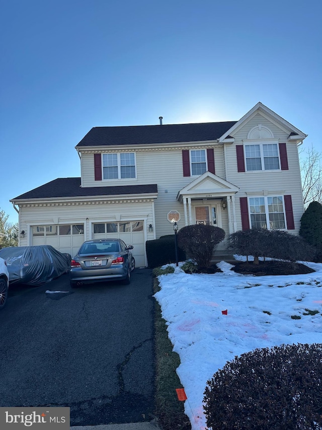 view of front of property featuring a garage