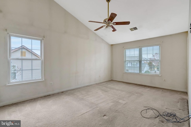 empty room with visible vents, baseboards, carpet flooring, high vaulted ceiling, and a ceiling fan