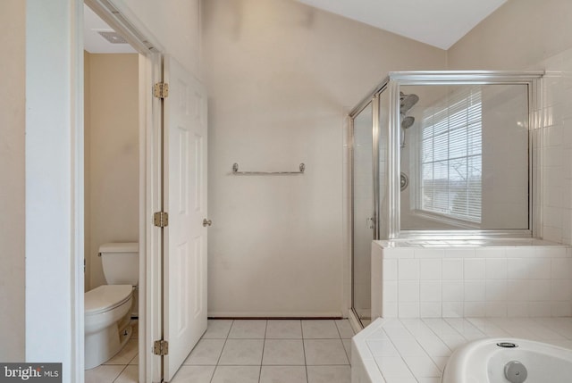 full bathroom with a garden tub, toilet, a shower stall, and tile patterned flooring