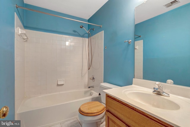 bathroom with vanity, visible vents,  shower combination, tile patterned floors, and toilet