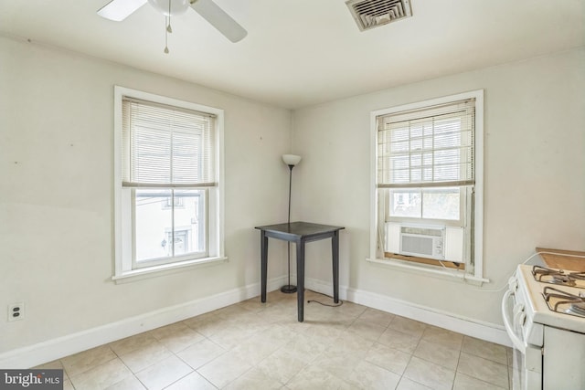 interior space with cooling unit and ceiling fan