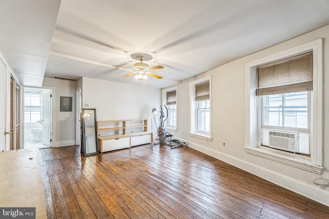 workout room with cooling unit, hardwood / wood-style flooring, and ceiling fan