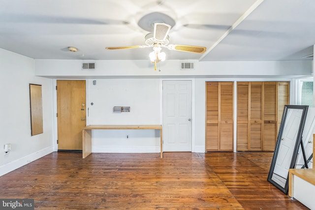 interior space with dark hardwood / wood-style floors and ceiling fan