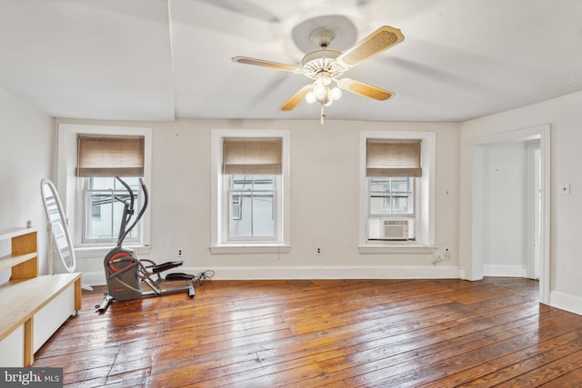 interior space with hardwood / wood-style floors, ceiling fan, and cooling unit