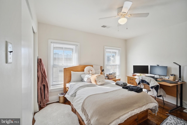 bedroom with hardwood / wood-style floors and ceiling fan