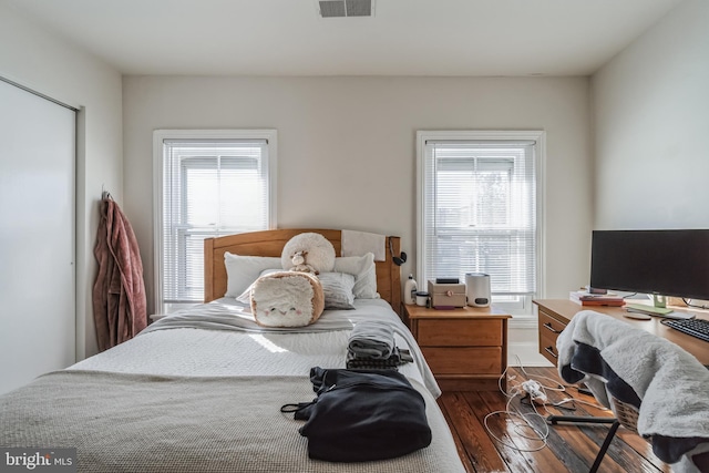 bedroom featuring multiple windows