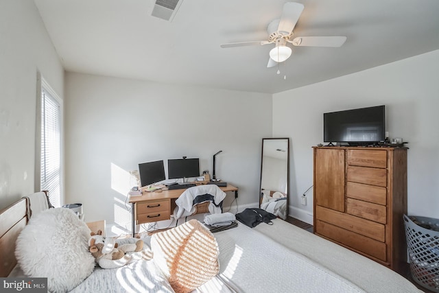 bedroom with wood-type flooring and ceiling fan