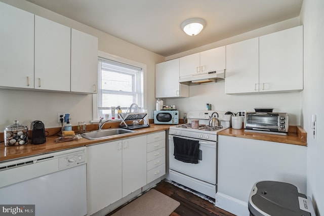 kitchen featuring dark hardwood / wood-style floors, butcher block countertops, white cabinetry, sink, and white appliances