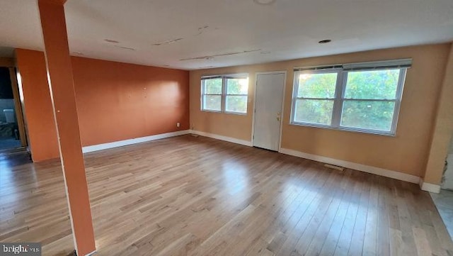 spare room with light hardwood / wood-style floors