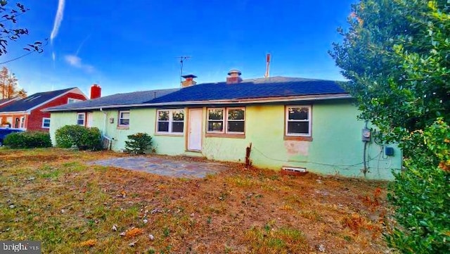 back of house with a patio