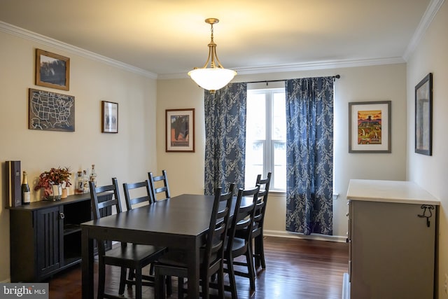 dining area featuring ornamental molding and dark wood-type flooring