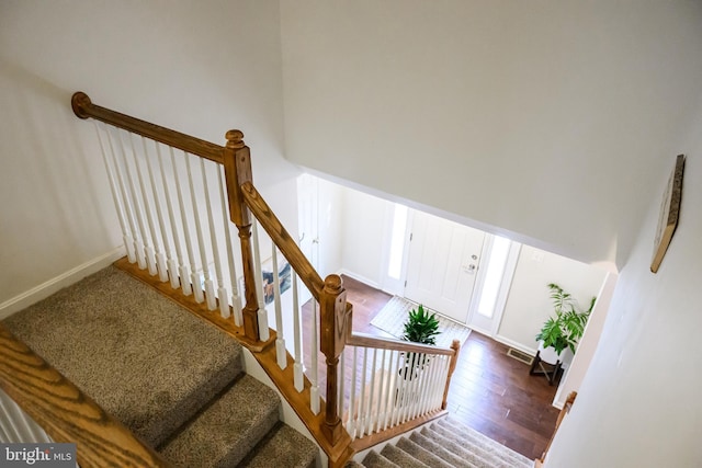 stairway featuring hardwood / wood-style floors