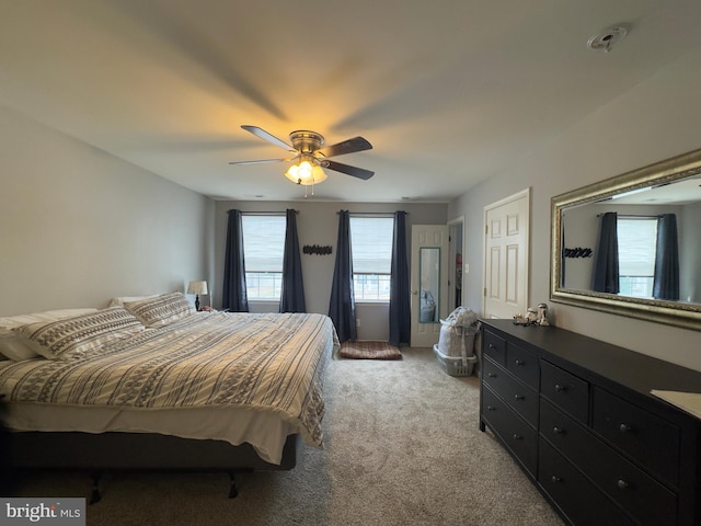 carpeted bedroom with ceiling fan