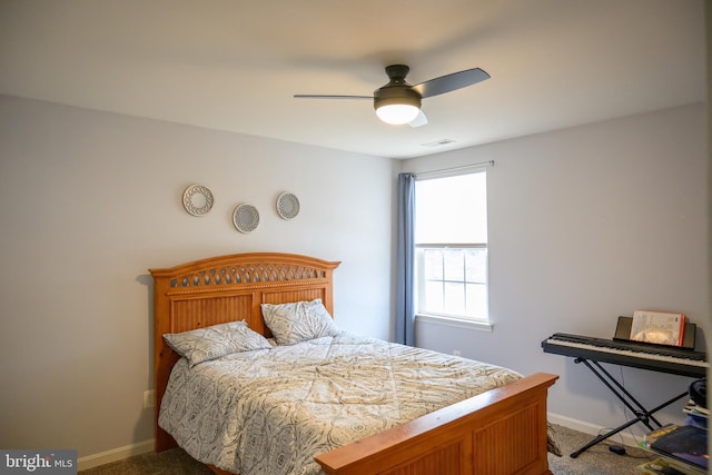 bedroom with ceiling fan and carpet