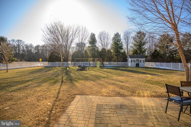 view of yard with a patio area and a storage unit