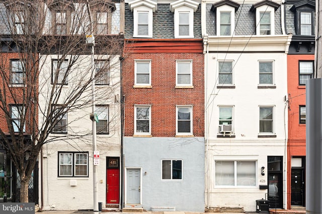 view of front of house featuring cooling unit