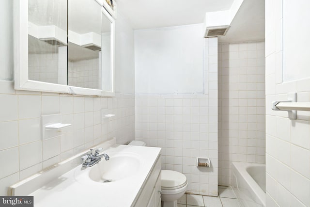 full bathroom with bathtub / shower combination, tile walls, vanity, toilet, and tile patterned floors